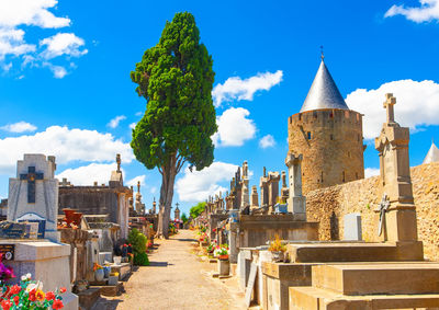  old cemetery  and marble tombstones for the graves in sunny day near the carcassonne castle. 