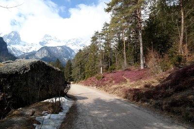 Scenic view of road and mountains against sky