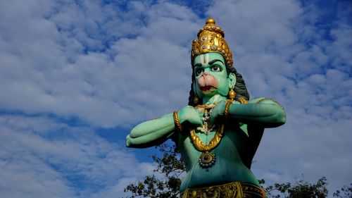 Low angle view of statue against sky