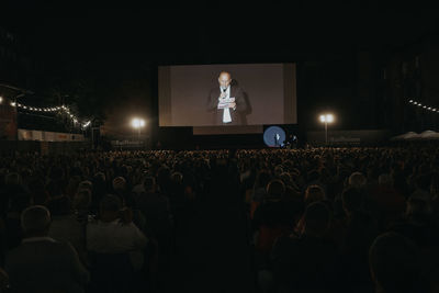 Group of people looking at music concert