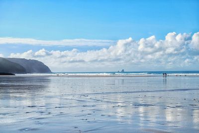 Scenic view of sea against blue sky