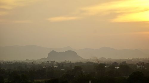 Scenic view of mountains against sky during sunset