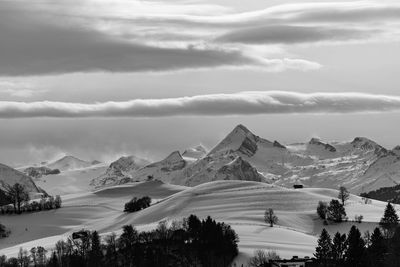 Scenic view of snowcapped mountains against sky