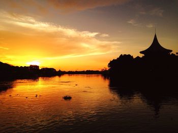 Reflection of clouds in water at sunset
