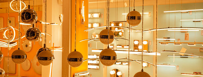 Contemporary chandelier, a branched ornamental light fixture designed to be mounted on ceilings 