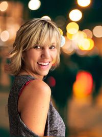 Portrait of smiling woman standing outdoors