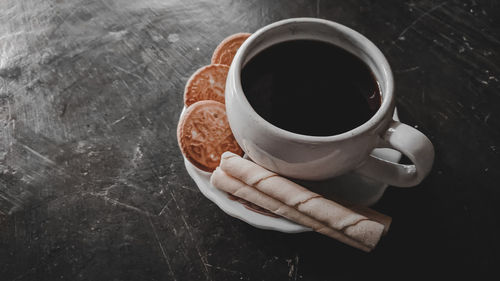 High angle view of coffee cup on table