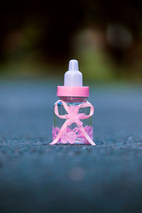 Close-up of toy bottle on table