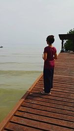 Full length of man standing on pier