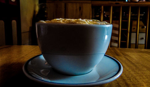 Close-up of coffee cup on table