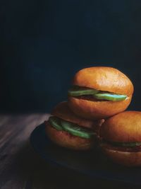 Close-up of mini burgers on table