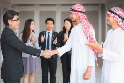 Business people handshaking during meeting