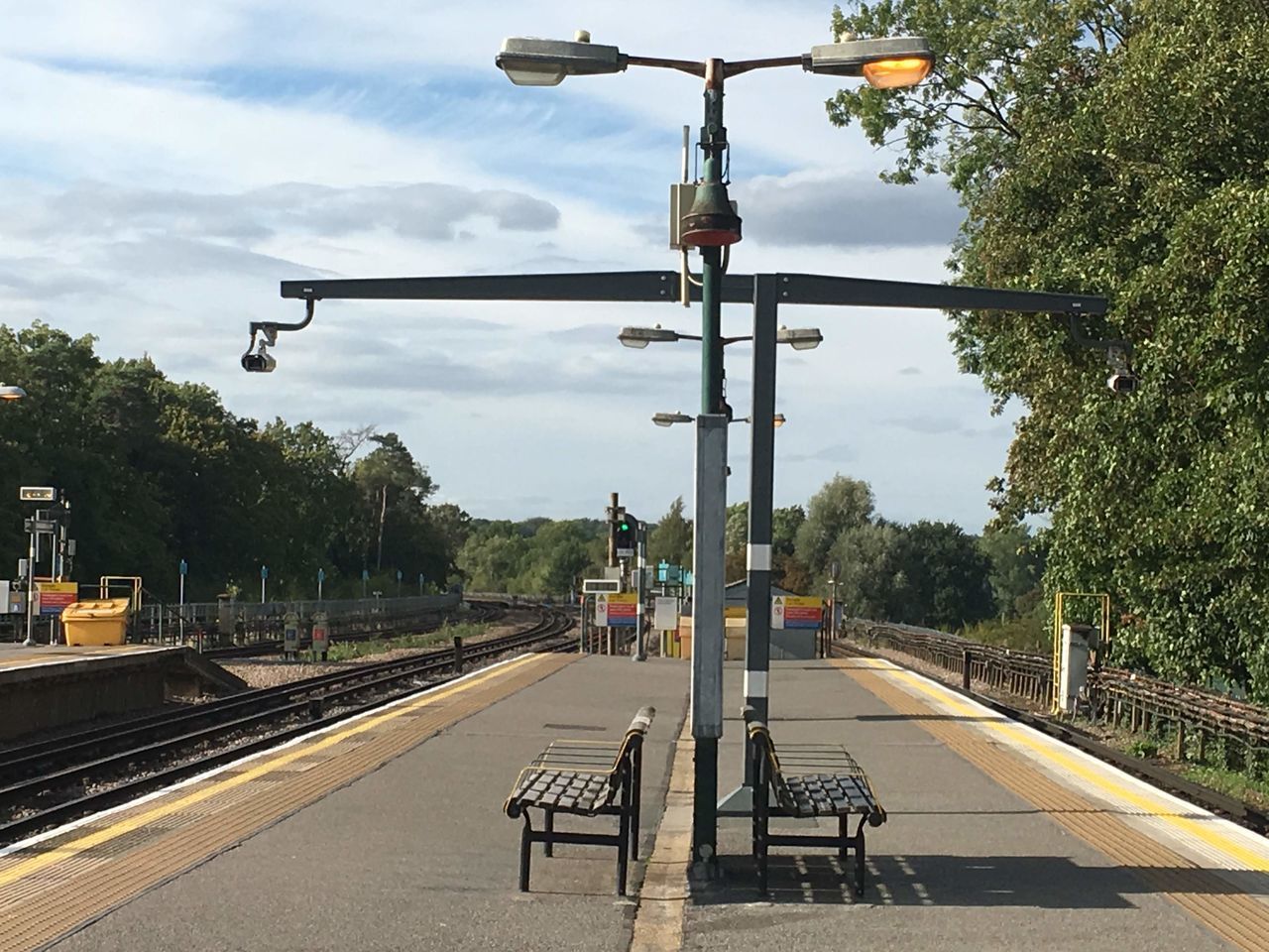 VIEW OF EMPTY RAILROAD TRACKS AGAINST SKY