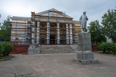 Low angle view of statue against building