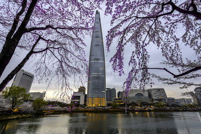 View of buildings at waterfront against sky