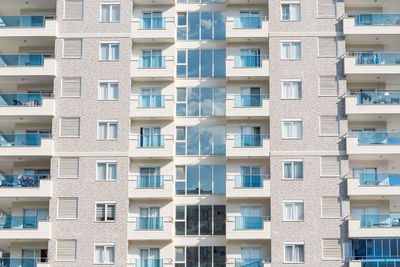 Front view of the windows of a residential apartment building. facade of a modern building.