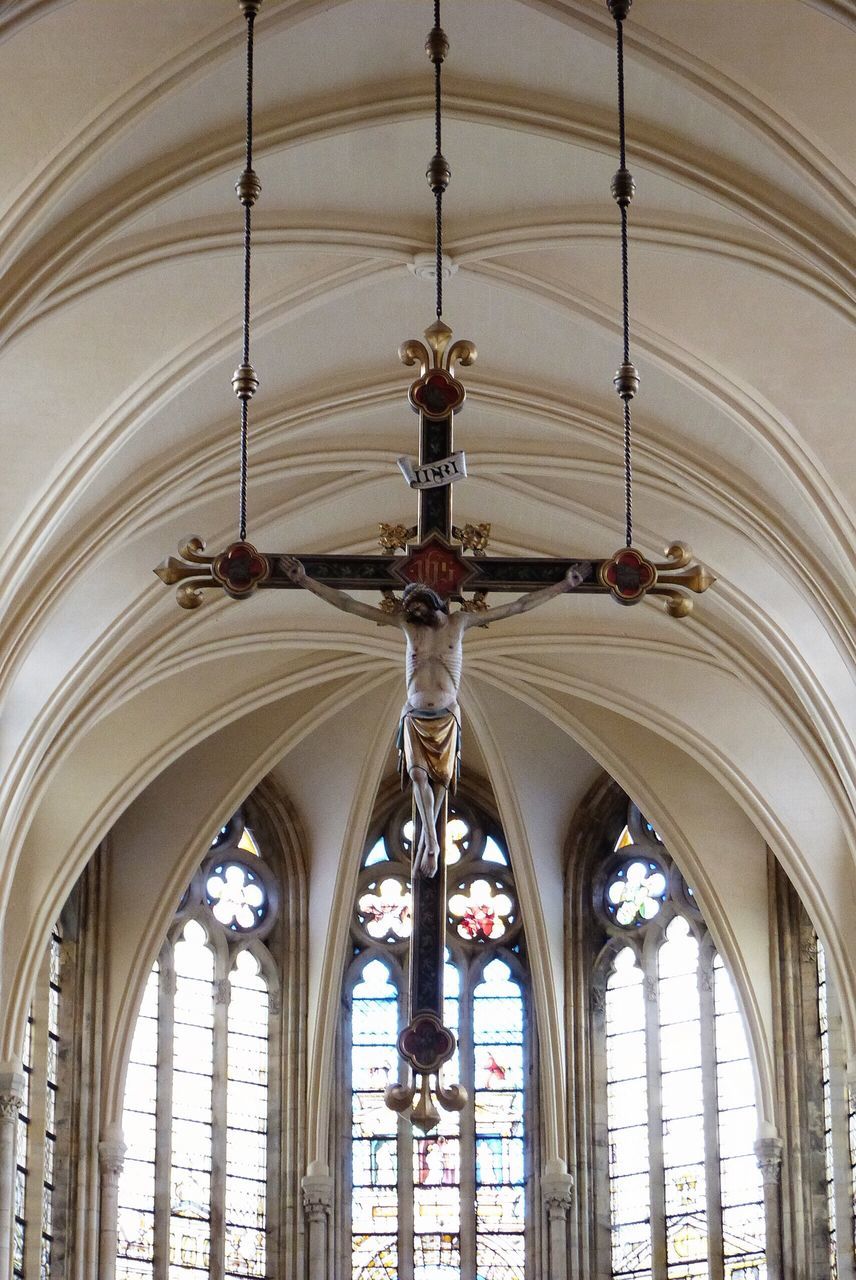 indoors, arch, ceiling, architecture, built structure, interior, low angle view, architectural column, in a row, window, church, no people, lighting equipment, hanging, architectural feature, religion, day, travel, glass - material, place of worship