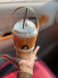 Close-up of hand holding drink