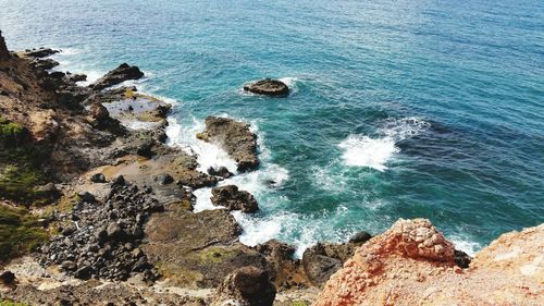 High angle view of rock formation in sea