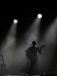 Full length of man playing in music concert