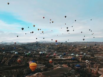 Aerial view of hot air balloons against sky