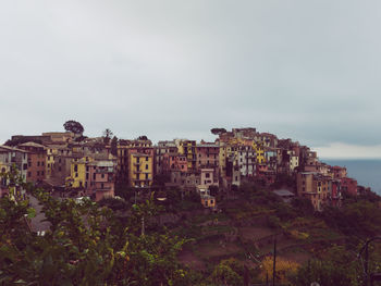 Buildings in city against sky