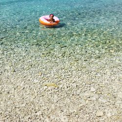 High angle view of person swimming in sea