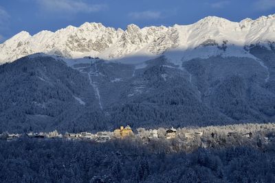 Scenic view of snowcapped mountains against sky