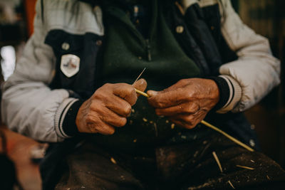 Close up hands man sculpting