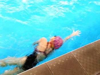 Man swimming in pool