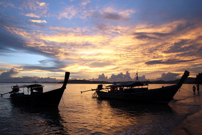 The scenic view on a sea with long boats from ao nang beach.