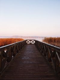 View of footbridge against clear sky