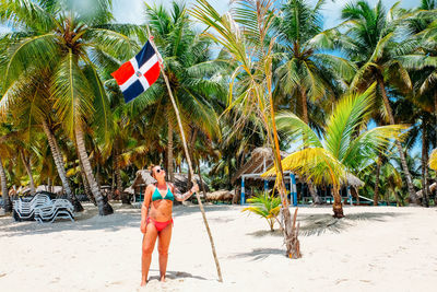 Full length of palm trees on beach