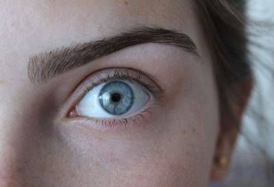 Cropped image of woman with gray eyes