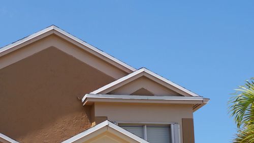 Low angle view of building against clear blue sky