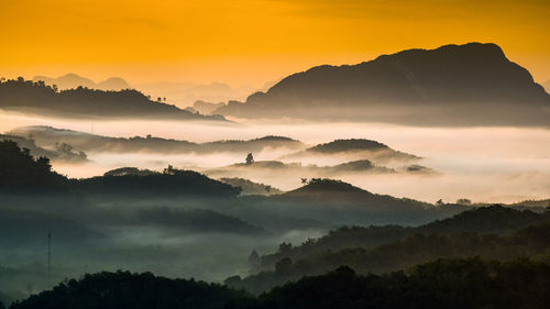 Scenic view of mountains against sky during sunset