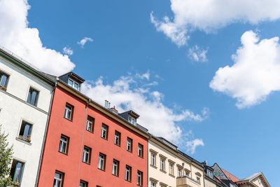 Low angle view of building against cloudy sky