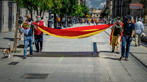 People walking on street in city