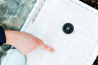 Low section of man standing on tiled floor