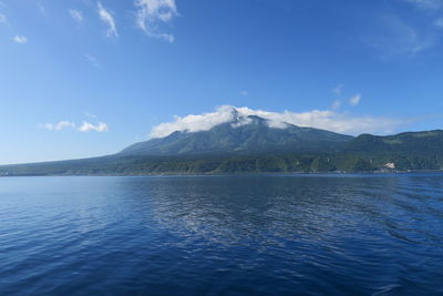 Scenic view of lake against blue sky