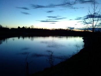 Scenic shot of calm lake against sky