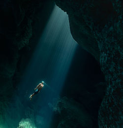 Mid adult man diving in sea