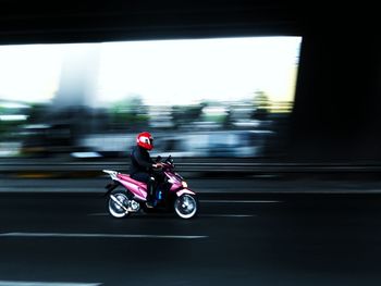 Blurred motion of car on road