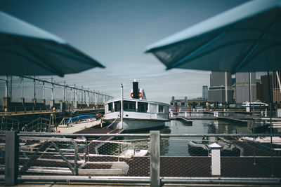 Boats moored at harbor