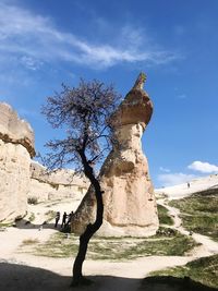 View of rock formation against cloudy sky