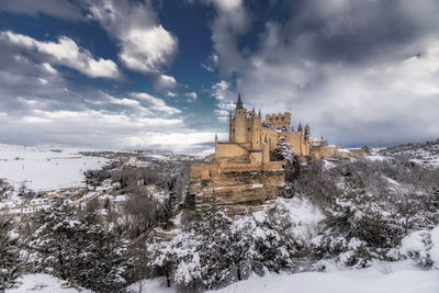 Buildings against sky during winter