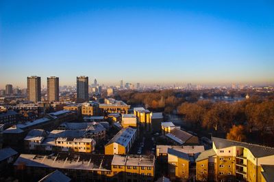 Cityscape against sky at dusk