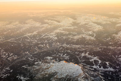 Aerial view of landscape against sky during sunset