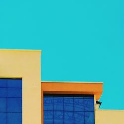 Low angle view of building against blue sky