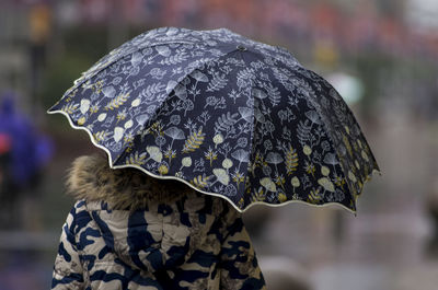 Rear view of woman against blurred background